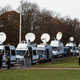 News trucks lined up to cover the first public appearance by the newly engaged couple, at Kensington Palace.